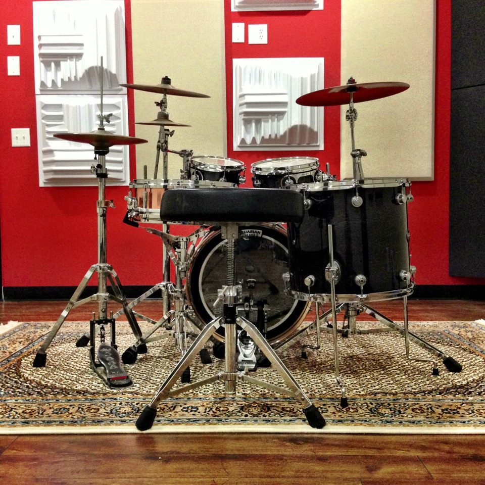 Auralex T-Fusors&trade; shown in White - installed on wall by drum kit